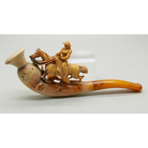 944 - Three carved Meerschaum pipes, cased