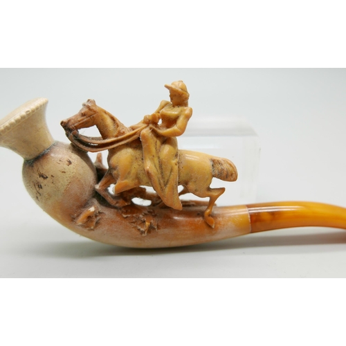 944 - Three carved Meerschaum pipes, cased