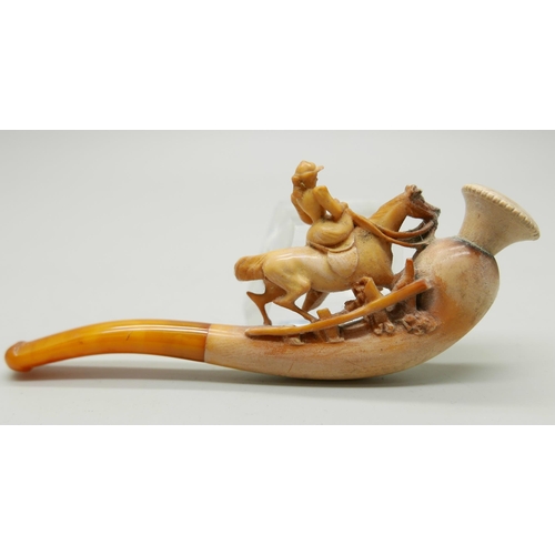 944 - Three carved Meerschaum pipes, cased