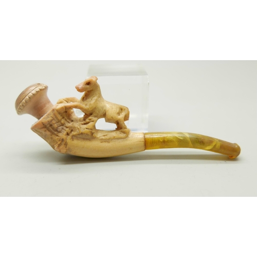 946 - Three small hand carved Meerschaum pipes, two with horses and one with a pair of stags, amber stems,... 