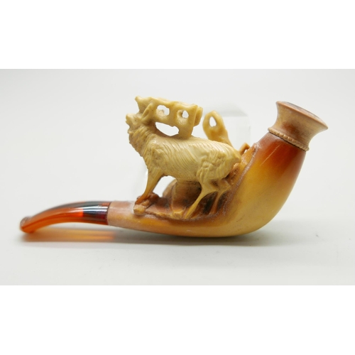 946 - Three small hand carved Meerschaum pipes, two with horses and one with a pair of stags, amber stems,... 