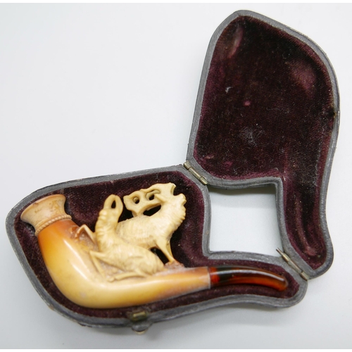 946 - Three small hand carved Meerschaum pipes, two with horses and one with a pair of stags, amber stems,... 