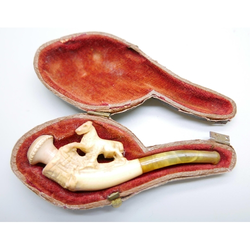 946 - Three small hand carved Meerschaum pipes, two with horses and one with a pair of stags, amber stems,... 