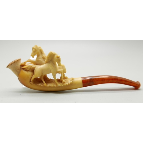 946 - Three small hand carved Meerschaum pipes, two with horses and one with a pair of stags, amber stems,... 