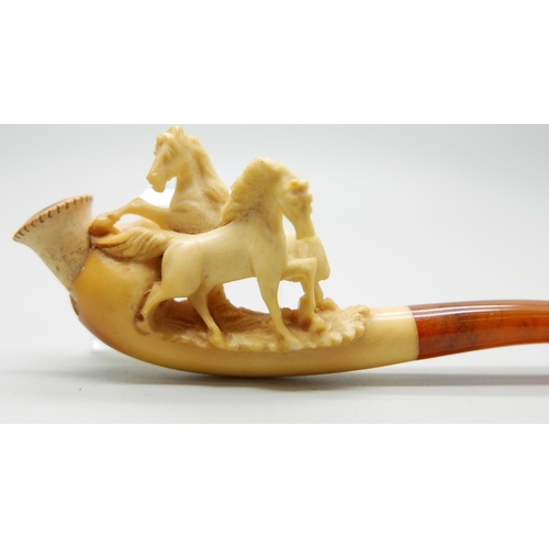 946 - Three small hand carved Meerschaum pipes, two with horses and one with a pair of stags, amber stems,... 