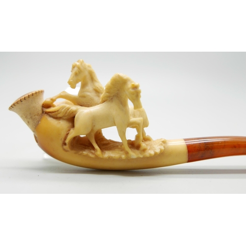 946 - Three small hand carved Meerschaum pipes, two with horses and one with a pair of stags, amber stems,... 