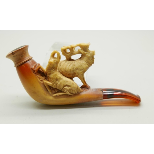 946 - Three small hand carved Meerschaum pipes, two with horses and one with a pair of stags, amber stems,... 