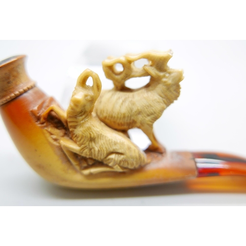 946 - Three small hand carved Meerschaum pipes, two with horses and one with a pair of stags, amber stems,... 