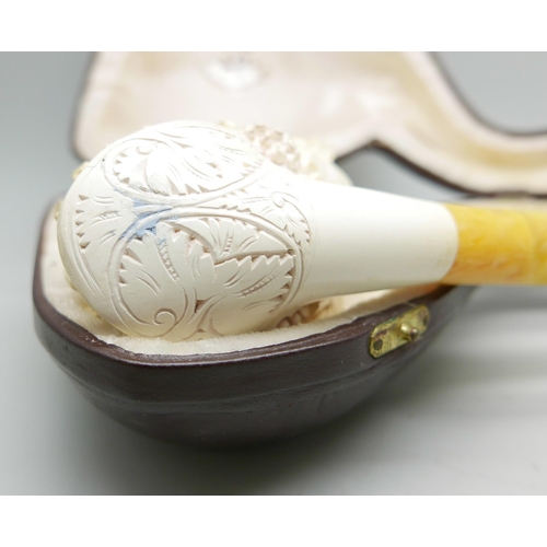 949 - A large carved Meerschaum pipe of a Greek God, cased