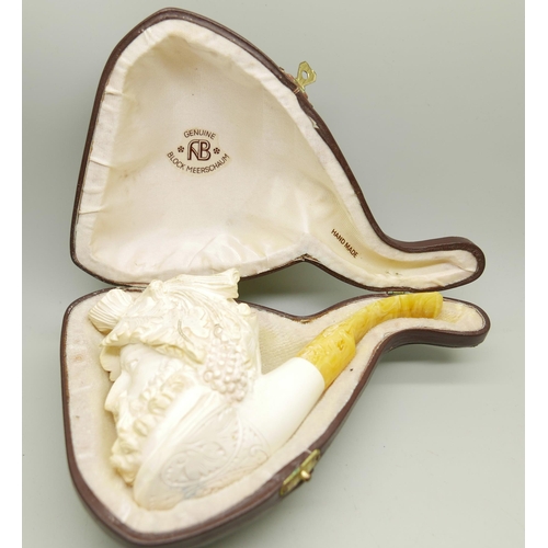 949 - A large carved Meerschaum pipe of a Greek God, cased