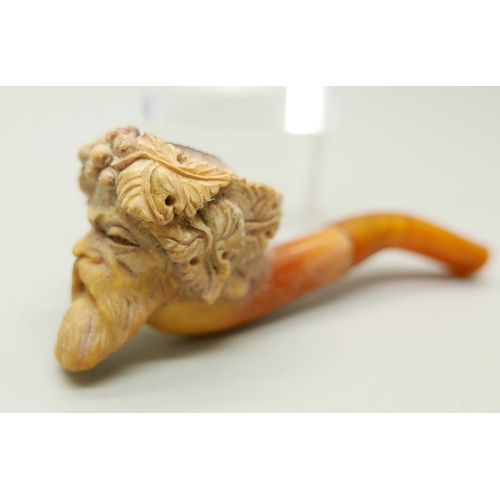 952 - Two carved Meerschaum pipes, one with head of an African man and one of a Greek god