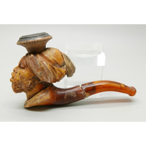 952 - Two carved Meerschaum pipes, one with head of an African man and one of a Greek god