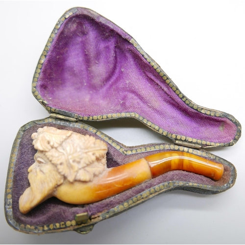 952 - Two carved Meerschaum pipes, one with head of an African man and one of a Greek god