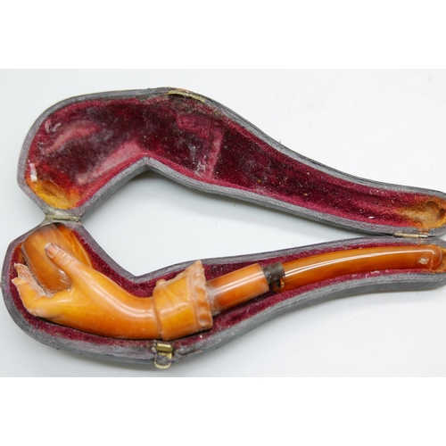 955 - Two hand carved Meerschaum pipes in the form of a lady's hand in glove, the larger pipe with broken ... 