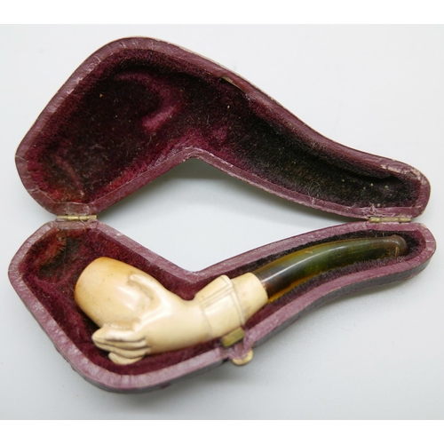 955 - Two hand carved Meerschaum pipes in the form of a lady's hand in glove, the larger pipe with broken ... 