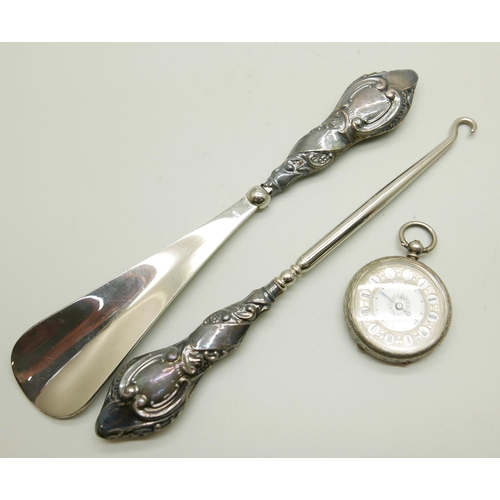 964 - A silver mounted button hook and shoe horn and a silver fob watch