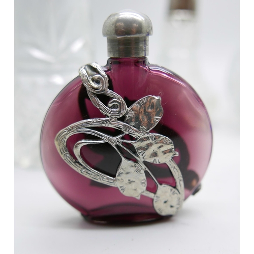 998 - Seven scent bottles including silver mounted, one a/f