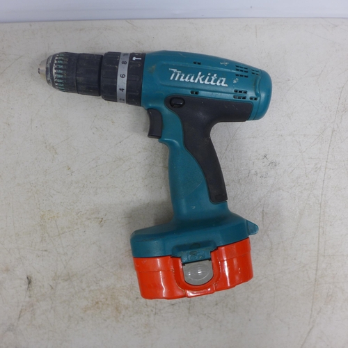 A Makita 8390D 18v cordless drill a Makita 8280D 14.4v cordless drill an 18v battery charger two 1