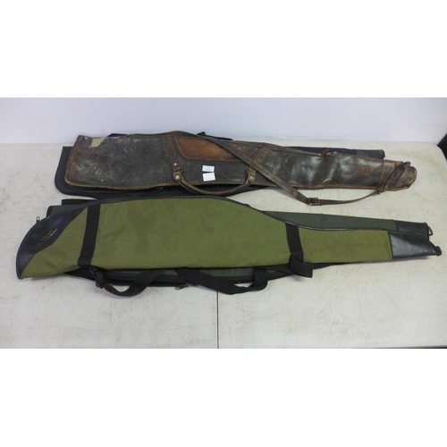 2086 - Three canvas gun cases and a brown leather gun case