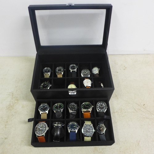 2104 - A display box containing gentleman's wristwatches ( 19 per box)