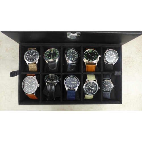 2104 - A display box containing gentleman's wristwatches ( 19 per box)