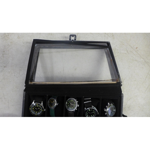 2105 - A display box containing gentleman's wristwatches (20 per box)