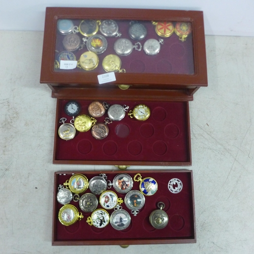 2108 - A display cabinet with three drawers of pocket watches