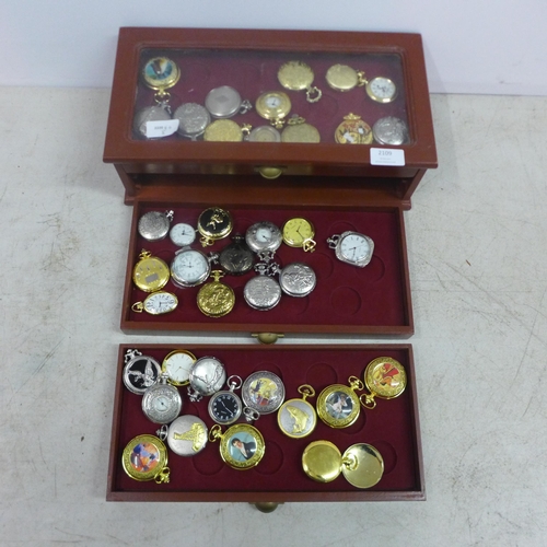 2109 - A display cabinet with three drawers of pocket watches