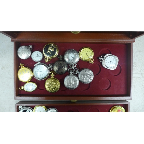 2109 - A display cabinet with three drawers of pocket watches