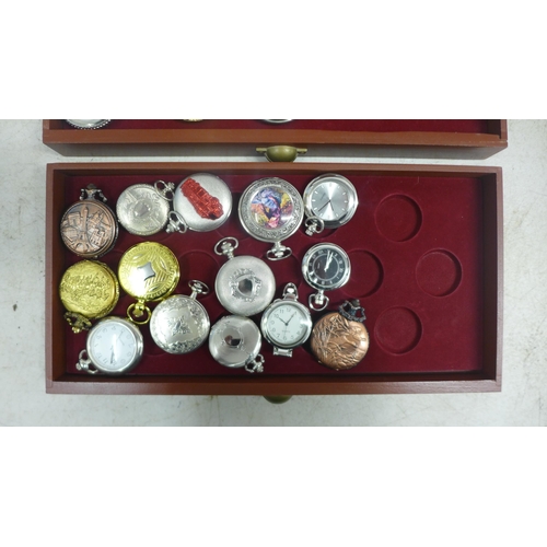 2110 - A display cabinet with three drawers of pocket watches