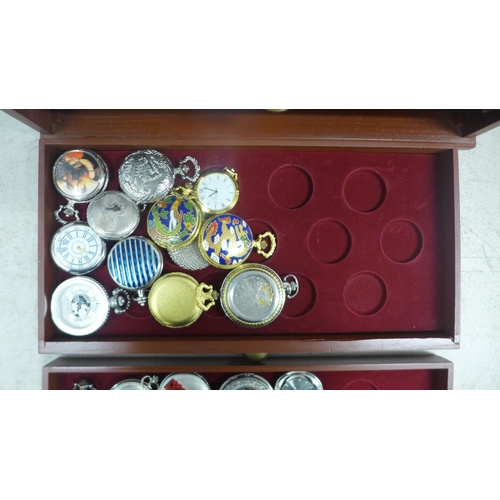 2110 - A display cabinet with three drawers of pocket watches