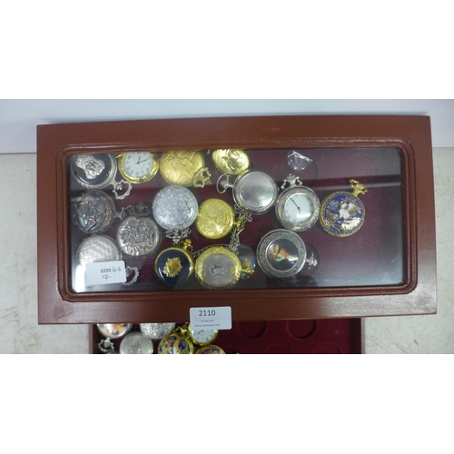 2110 - A display cabinet with three drawers of pocket watches