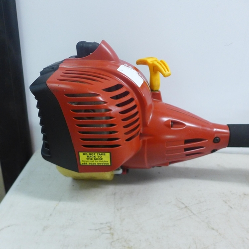 2110C - A Homelite mighty lite petrol driven grass strimmer. *Police repossession