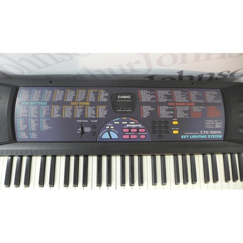 2118 - A Casio CTK-560L 100 Song Bank keyboard with key lighting system and stand