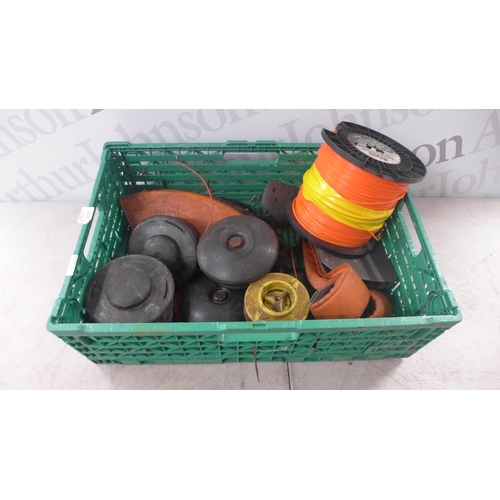 2131 - A quantity of grass trimmer spares and repairs items including a reel of Nylon trimmer line, a quant... 