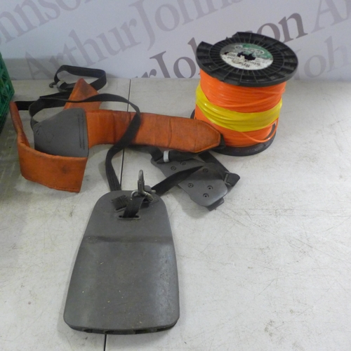 2131 - A quantity of grass trimmer spares and repairs items including a reel of Nylon trimmer line, a quant... 