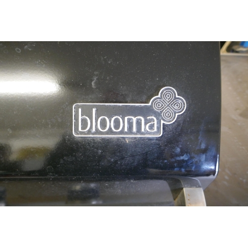 2150 - A gas fueled Blooma BBQ with electronic ignition, 4 burners, weather resistant cover and a part full... 