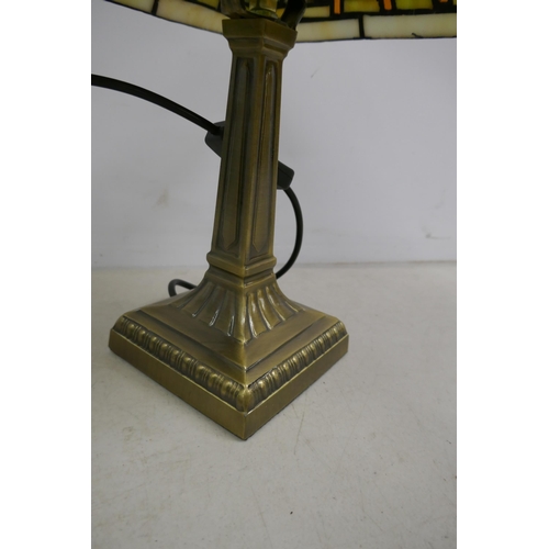 2398 - A quantity of lighting including a Tiffany style lamp, brushed brass effect lamp, angle poise style ... 