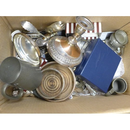 1257 - Two boxes of plated ware including a pair of candlesticks, two plated trays, napkin rings, silver pl... 