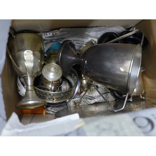 1257 - Two boxes of plated ware including a pair of candlesticks, two plated trays, napkin rings, silver pl... 