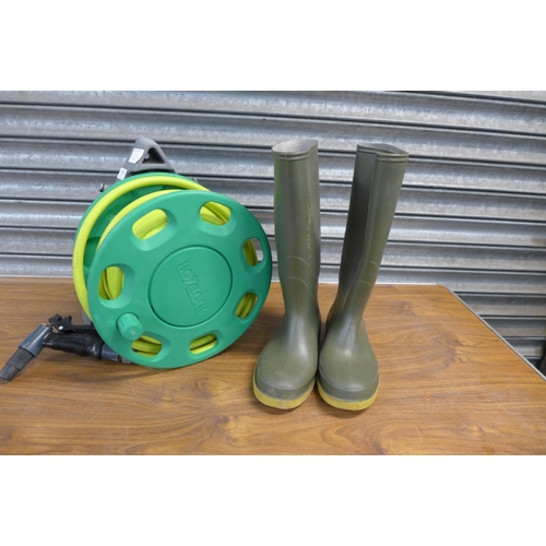 A hose pipe and reel and a pair of size 7 Dunlop Wellingtons