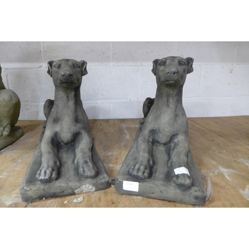 2230 - A pair of stone effect concrete greyhound garden ornaments