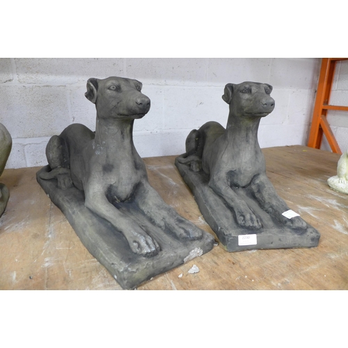 2230 - A pair of stone effect concrete greyhound garden ornaments