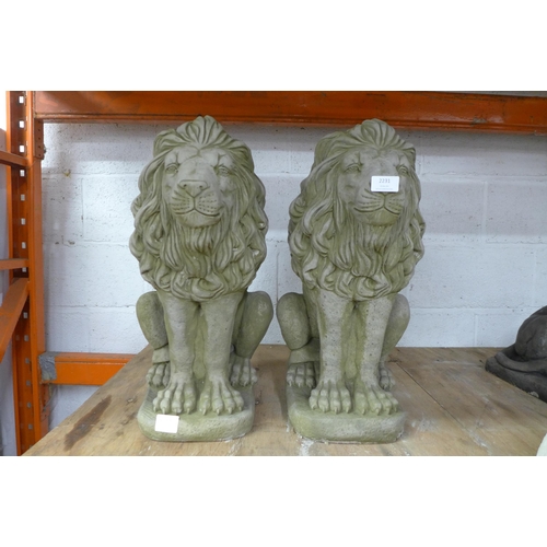 2231 - A pair of stone effect concrete lion garden ornaments - approximately 23