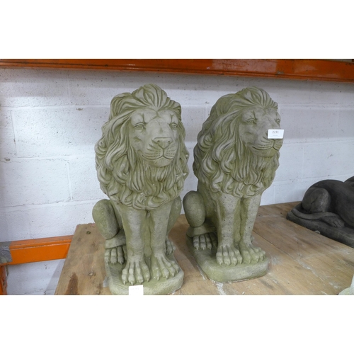 2231 - A pair of stone effect concrete lion garden ornaments - approximately 23