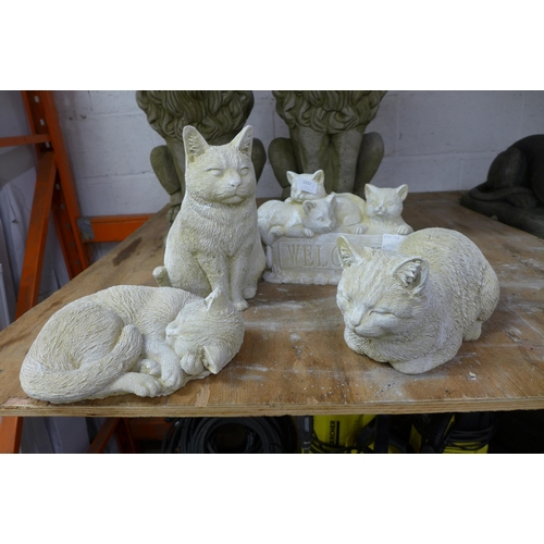 2232 - Four assorted stone effect concrete cat garden ornaments