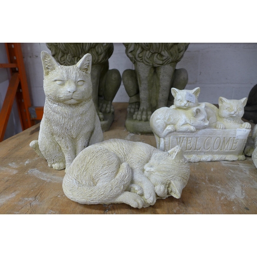 2232 - Four assorted stone effect concrete cat garden ornaments