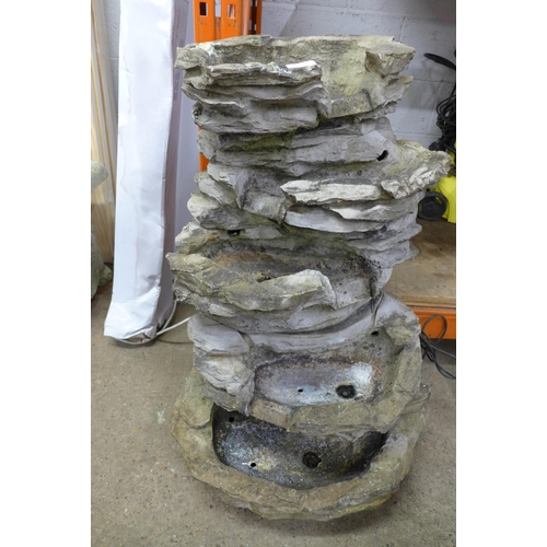 2236 - A stone effect water feature with LED lights and water pump (slight damage), a five tiered stone eff... 