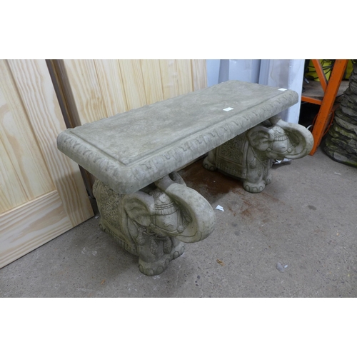 2238 - An oriental style stone effect concrete garden bench with elephant pedestal base