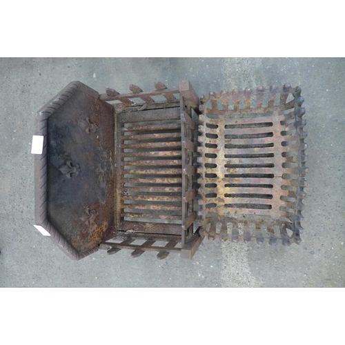 2289 - 2 Cast metal dog grates and a brass coal scuttle